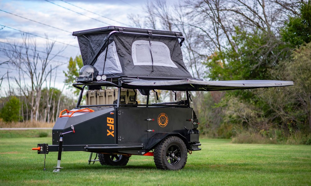 Built for Extreme (BFX) overland micro-trailer parked in a grassy field.