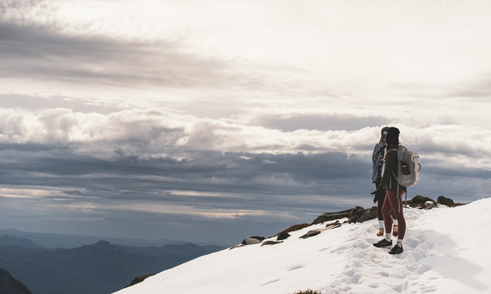 Couple hiking on Mount Rainier in winter