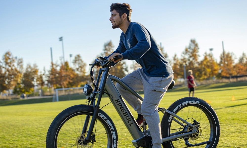 man cycling outside on the grass