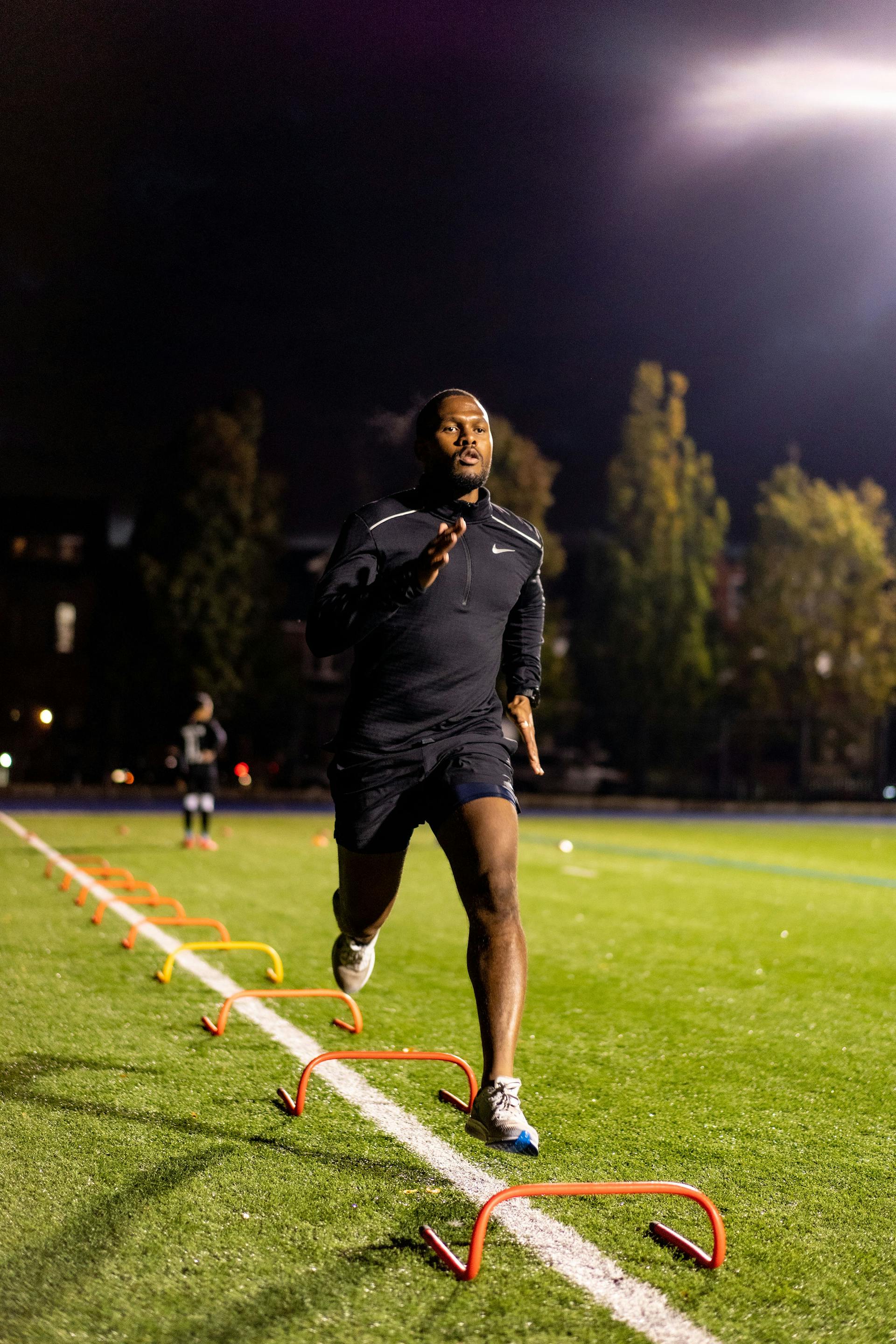 man exercising at night working out running outdoors high intensity dark nighttime