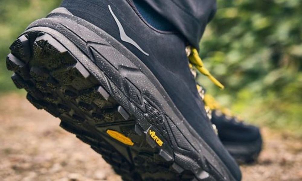 side view of black hiking shoe in nature