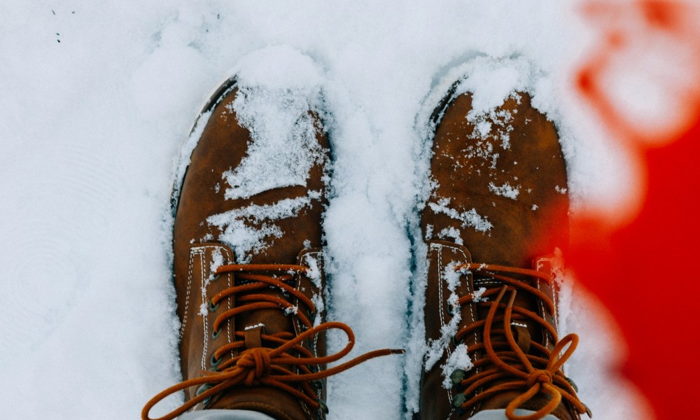 Man wearing hiking boots in the snow