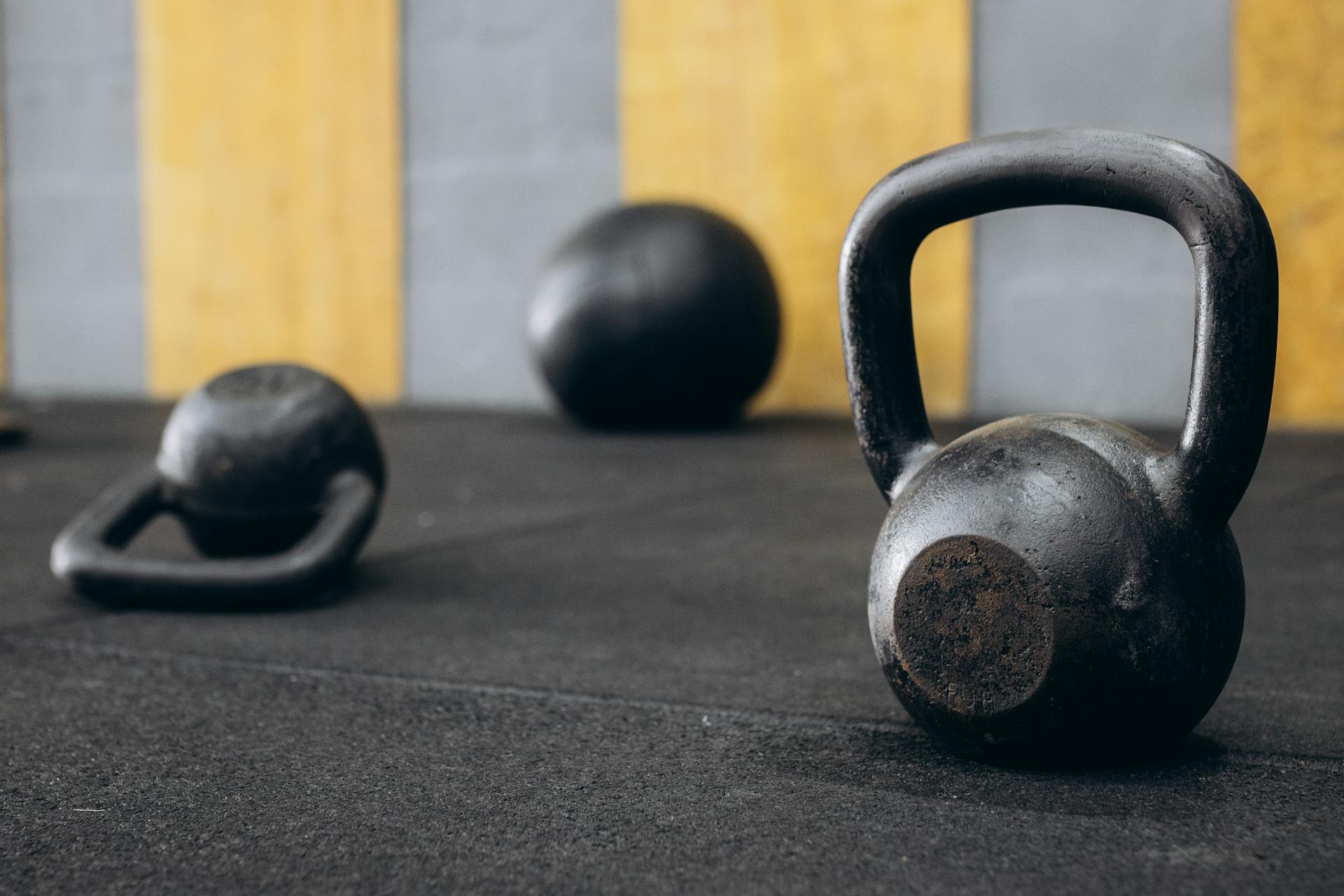 kettlebells lying around on floor