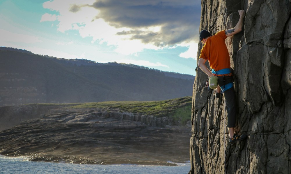 Man rock climbing at Mount Brown in Tasmania