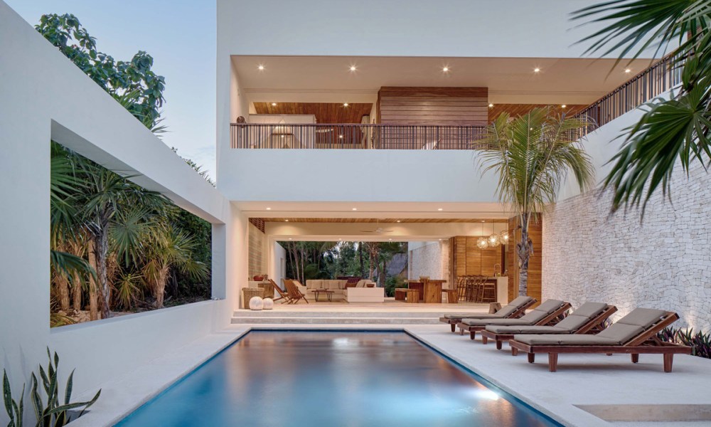 a photo of the pool and main living area at casa xixim