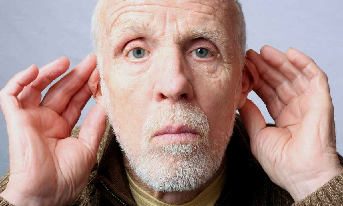 Man holding his ears