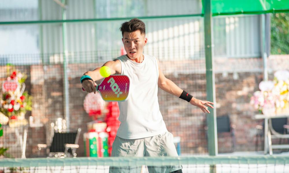 man playing pickleball