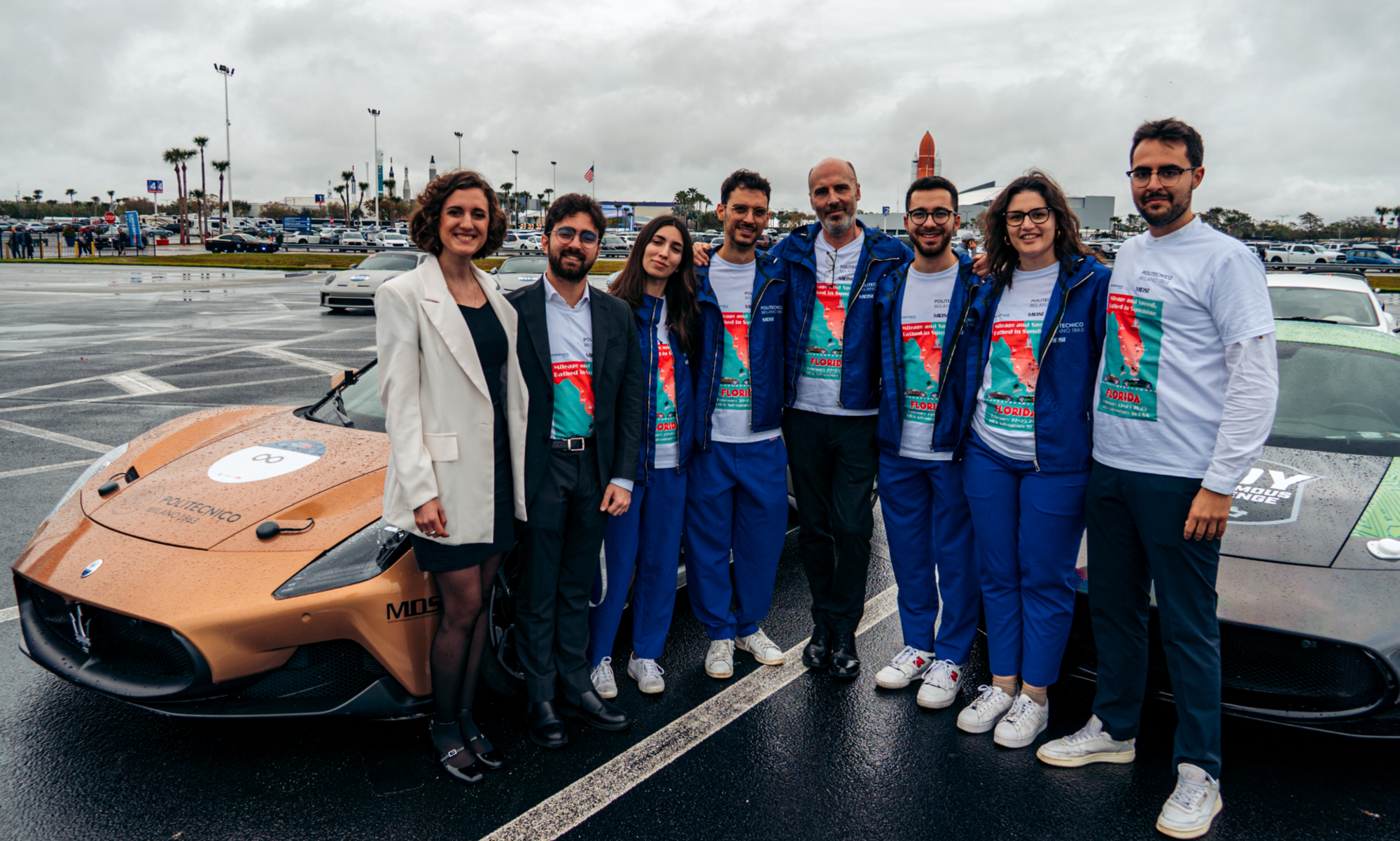 Team members with the two Maseratis who are involved with the world's autonomous speed record with the autonomous Indy challenge.