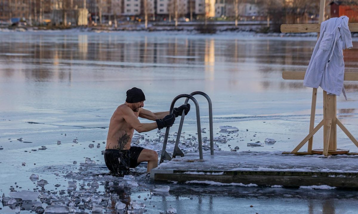 cold plunge man taking ice bath ice lake swim